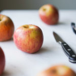whole apples with a peeler, and paring knife