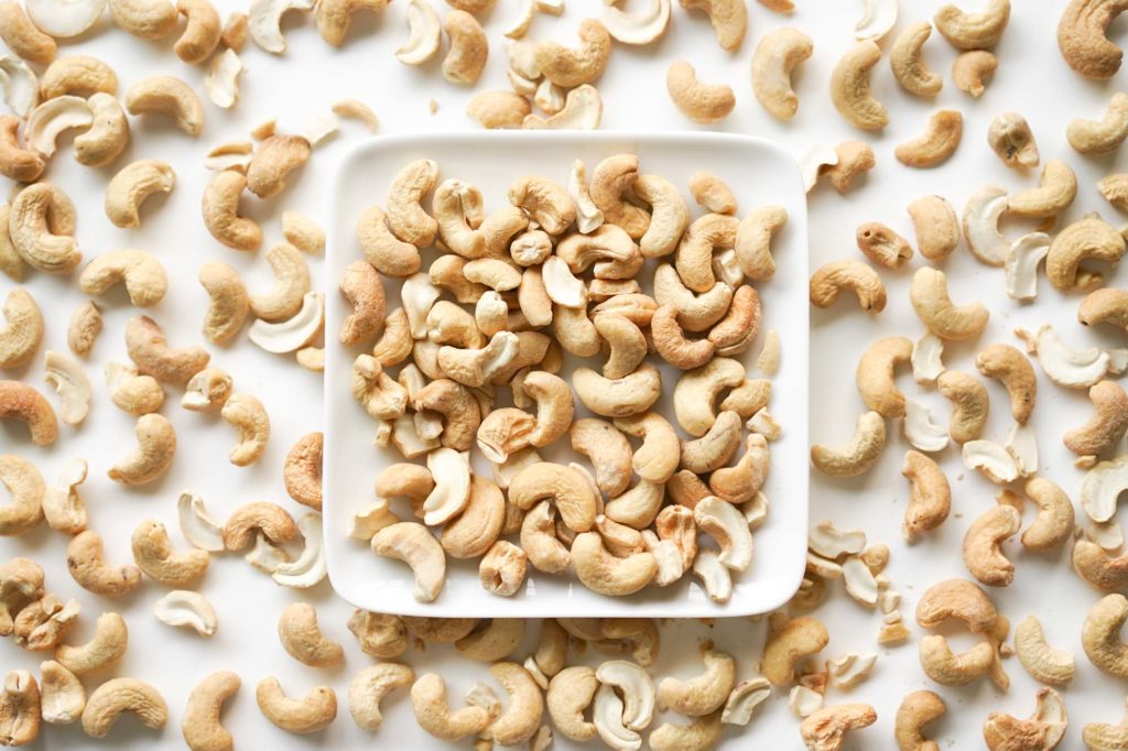 plate and table full of cashews