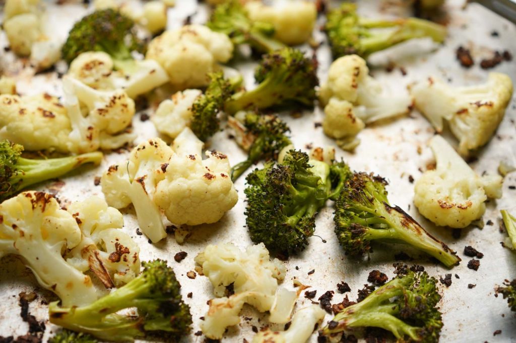 closeup of roasted broccoli and cauliflower