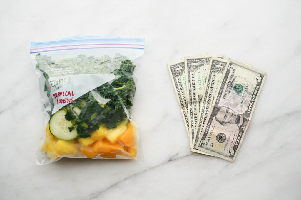 plastic smoothie pack next to dollar bills