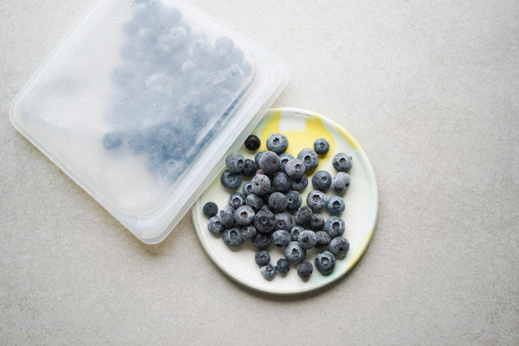 pouring blueberries out of freezer bag