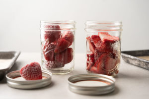 strawberries in glass jars