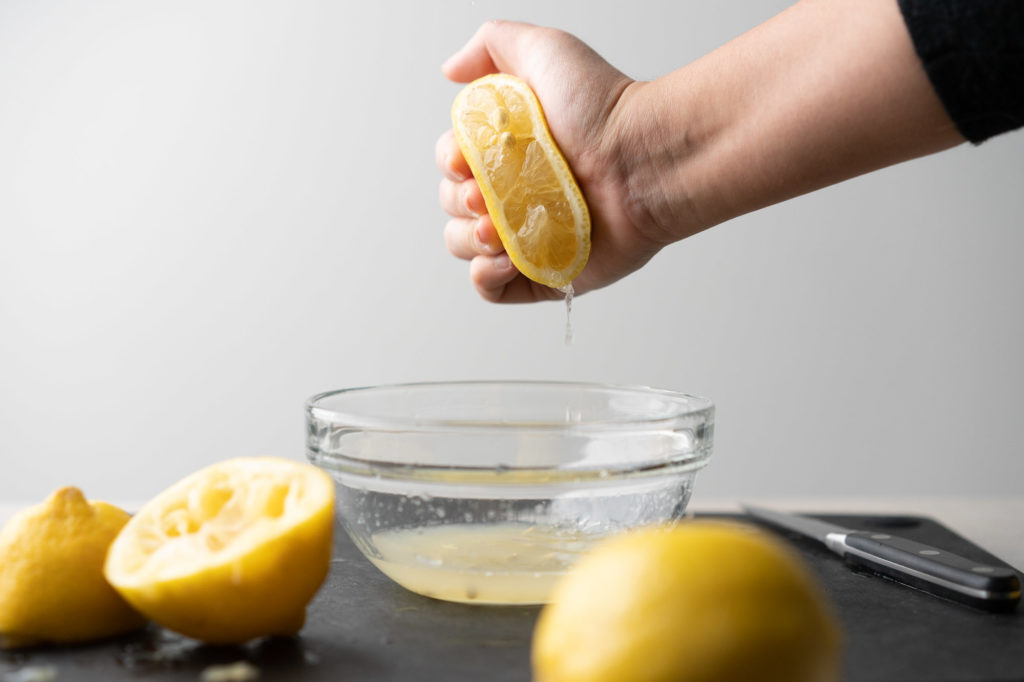 squeezing lemon by hand