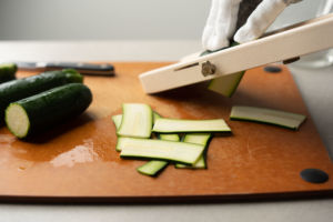 slicing zucchini with mandoline slicer