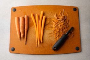 peeled carrots on cutting board