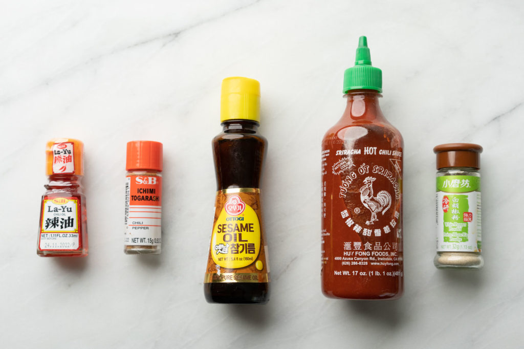 ramen spices and sauces: chili oil, sriracha, pepper