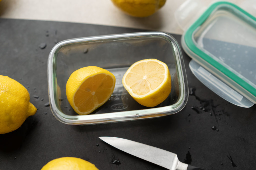 cut lemons in glass food container