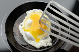 breaking egg yolk