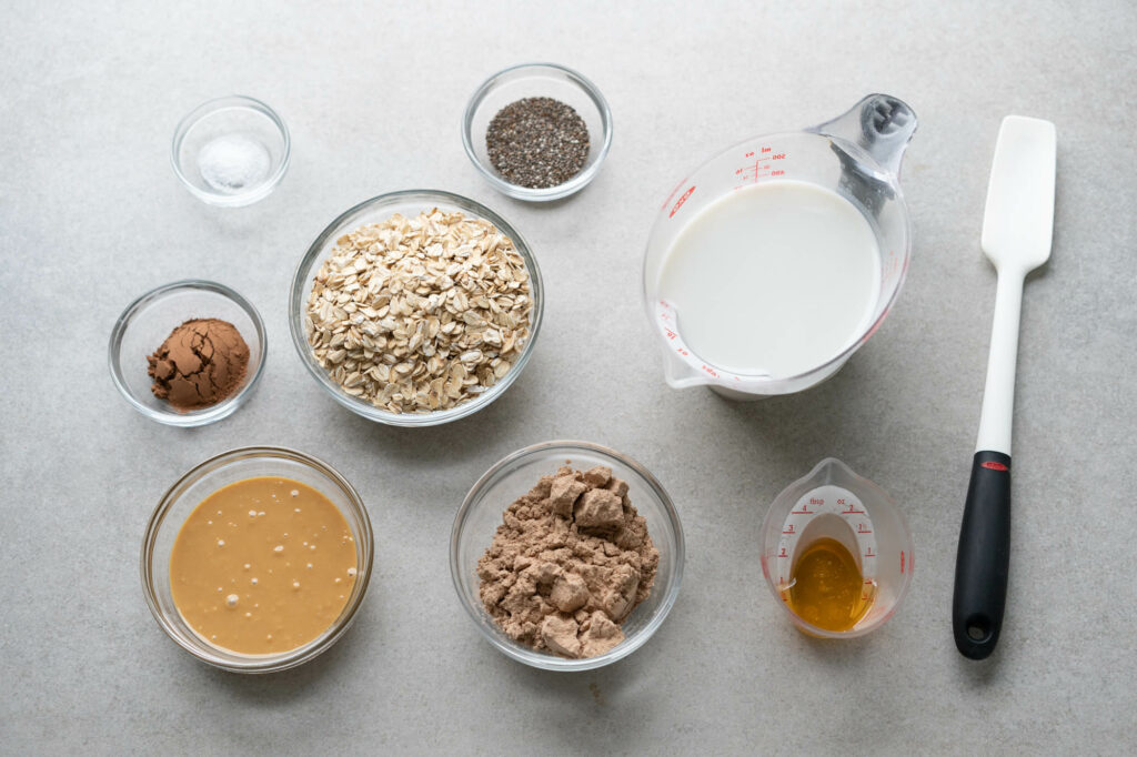 all ingredients for overnight oats with chocolate and peanut butter