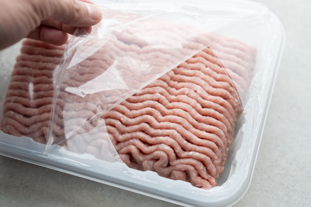 opening package of ground turkey
