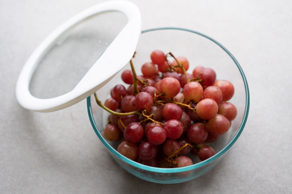 grapes in glass food storage container