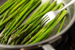 piercing asparagus with fork