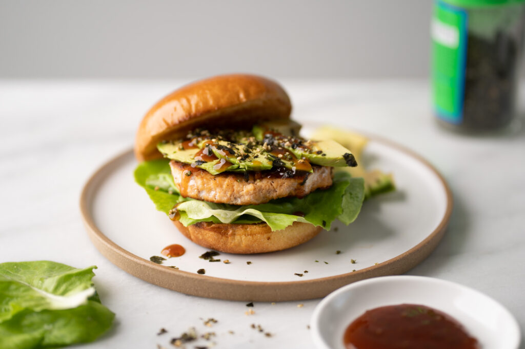 Asian inspired salmon burger, with avocado, teriyaki sauce